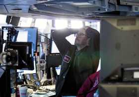 Corredores reaccionan durante el cierre de la Bolsa de Nueva York.