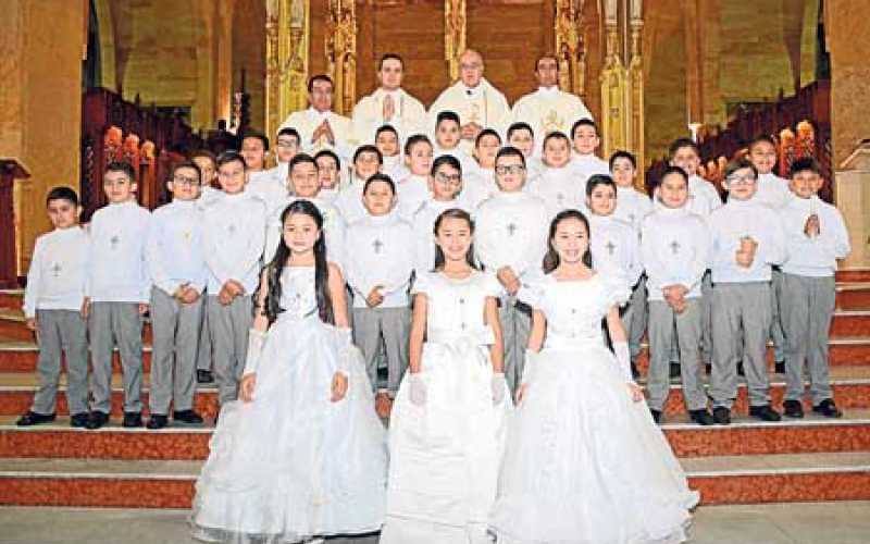 Niños y niñas que recibieron el sacramento de la Comunión en eucaristía que se celebró el 18 de agosto.  